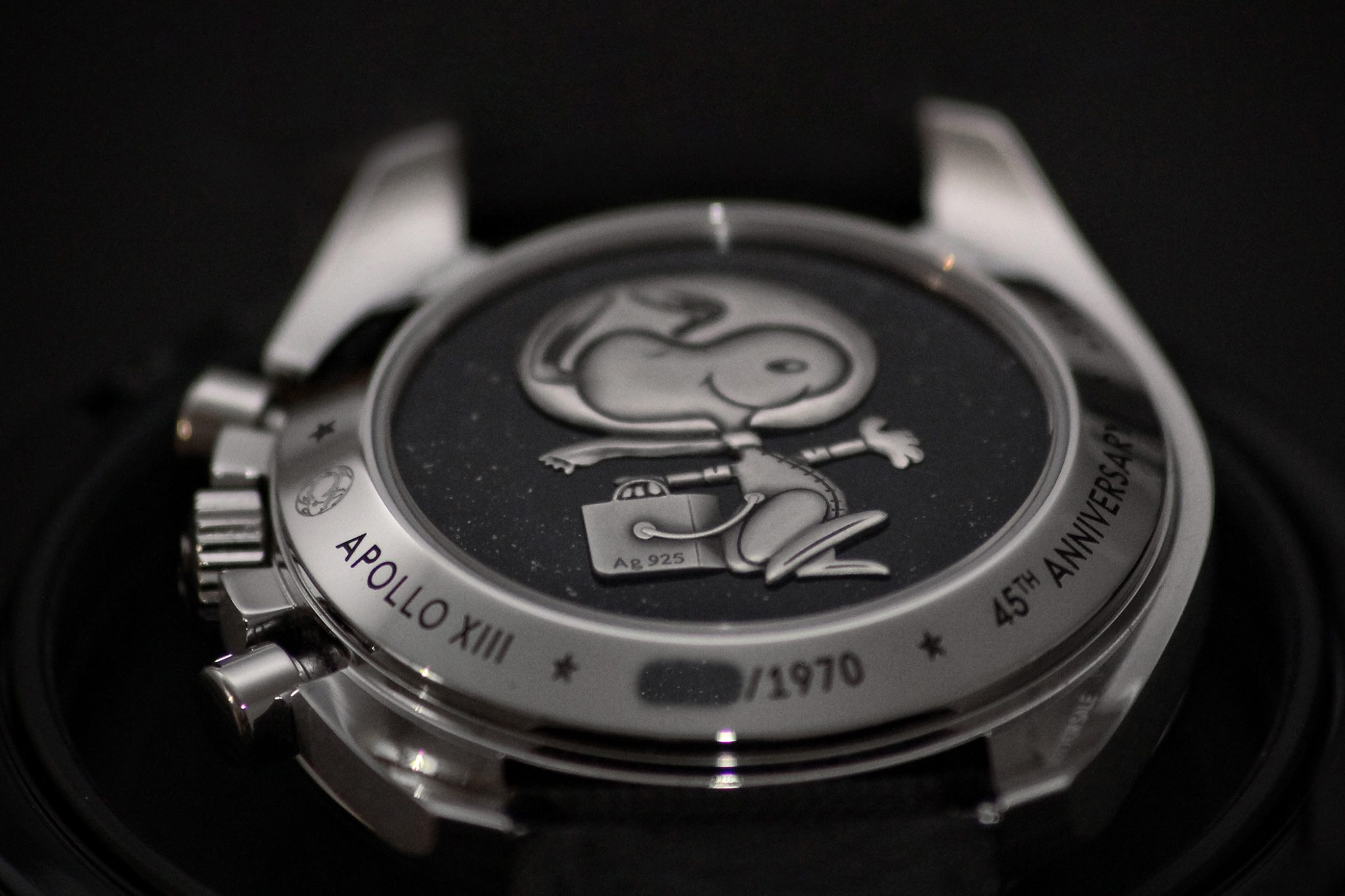 OMEGA Speedmaster Apollo 13 45th Anniversary Silver Snoopy Award Limited Edition. On the caseback: a silver medallion with a smiling Snoopy in astronaut attire