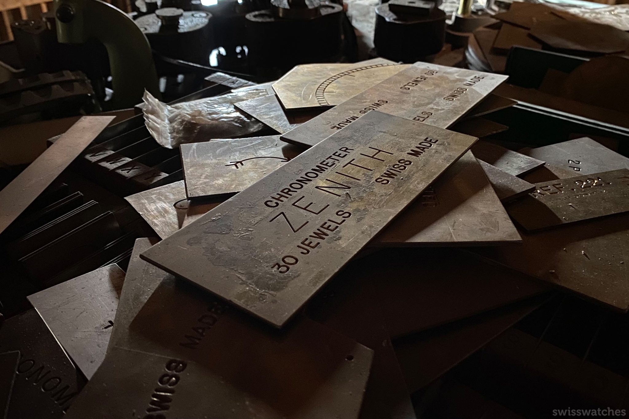 A lot of panels spread over a table indicating the name of watch and some details about the same
