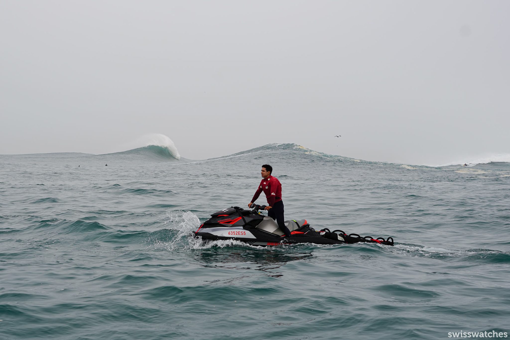 TUDOR-Surfing-Challenge-Nazare-2022-Surfer-on-jetskis