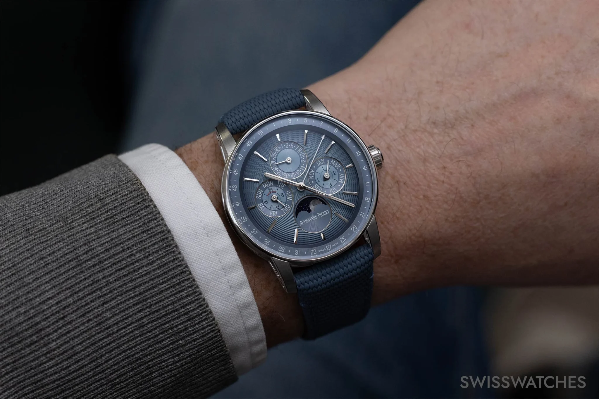 Code 11.59 with blue dial and perpetual calendar