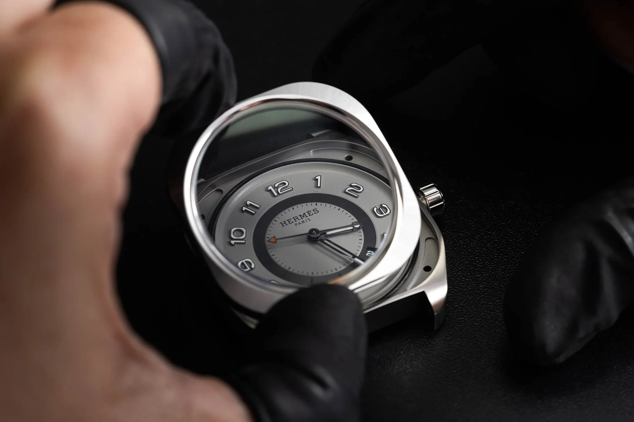 Assembling a Hermès H08 watch, showcasing expert craftsmanship and attention to detail in creating a sophisticated timepiece with a modern design and Swiss precision