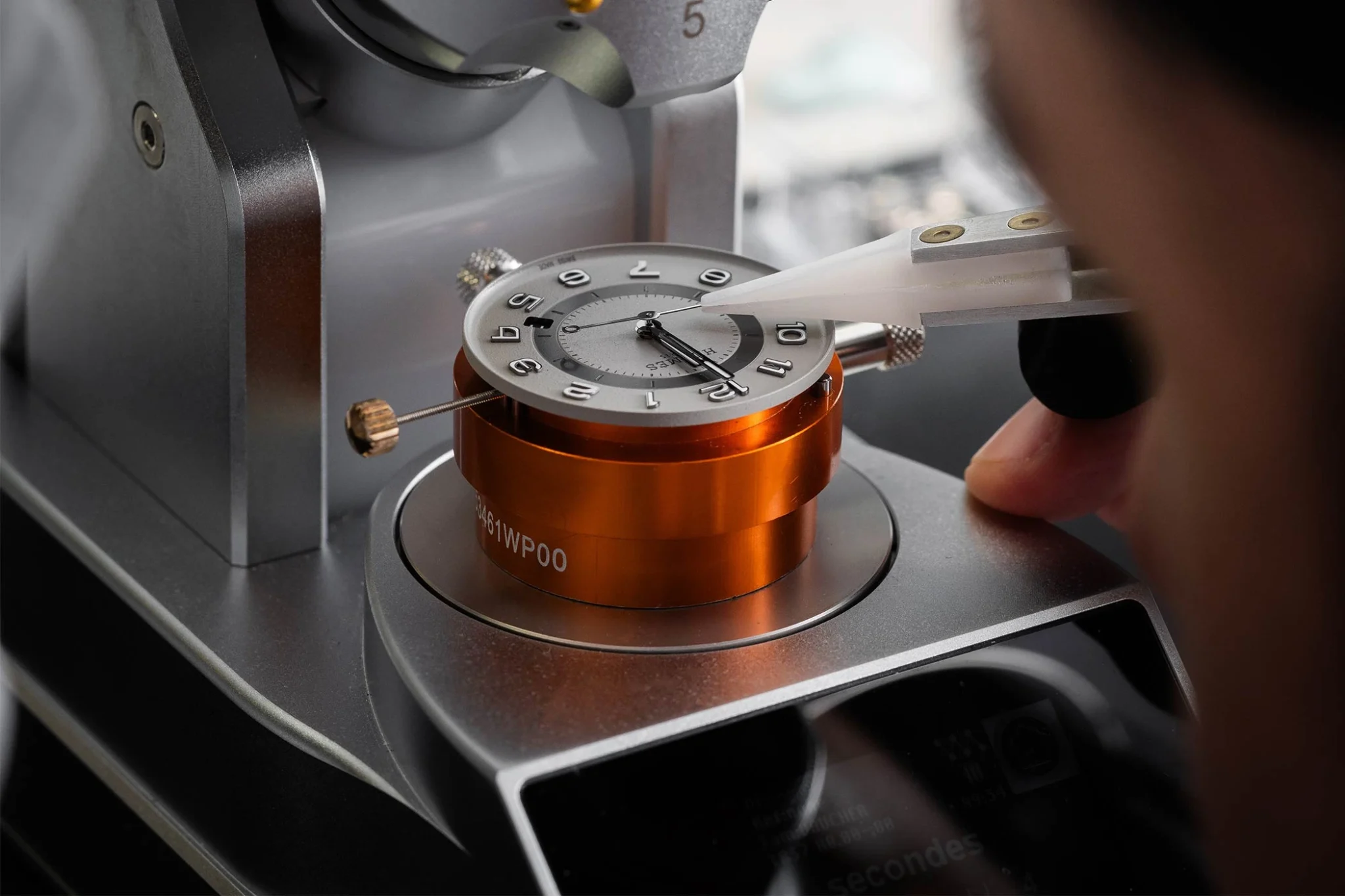 Assembling a Hermès H08 watch, showcasing expert craftsmanship and attention to detail in creating a sophisticated timepiece with a modern design and Swiss precision