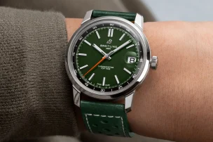 Wristshot of the Breitling Top Time B31 with a green dial and green leather strap.