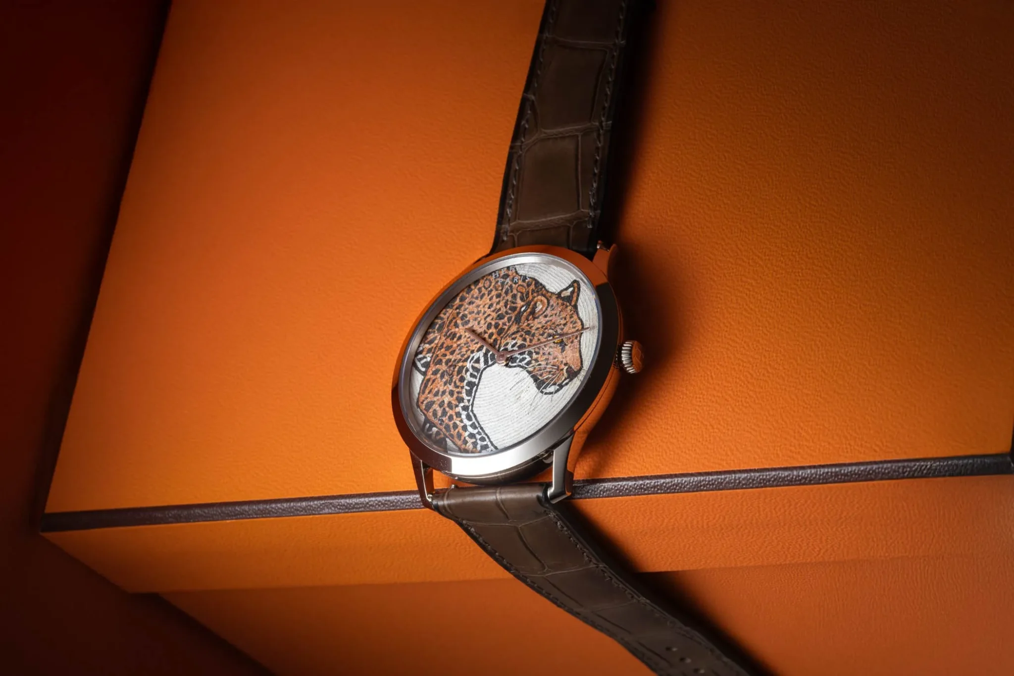 Hermès Watch Manufacture with Leather Marquetry Panthère design, showcasing exquisite Swiss craftsmanship and a luxurious combination of fine leather marquetry and iconic panther motif