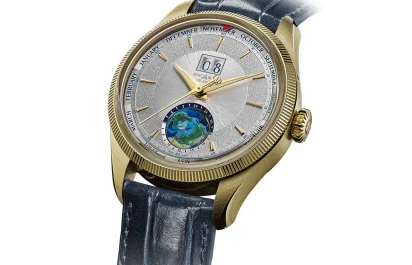Montblanc 1858 Geosphere Annual Calendar Limited Edition watch in gold case with a textured dial, world time display, and blue leather strap