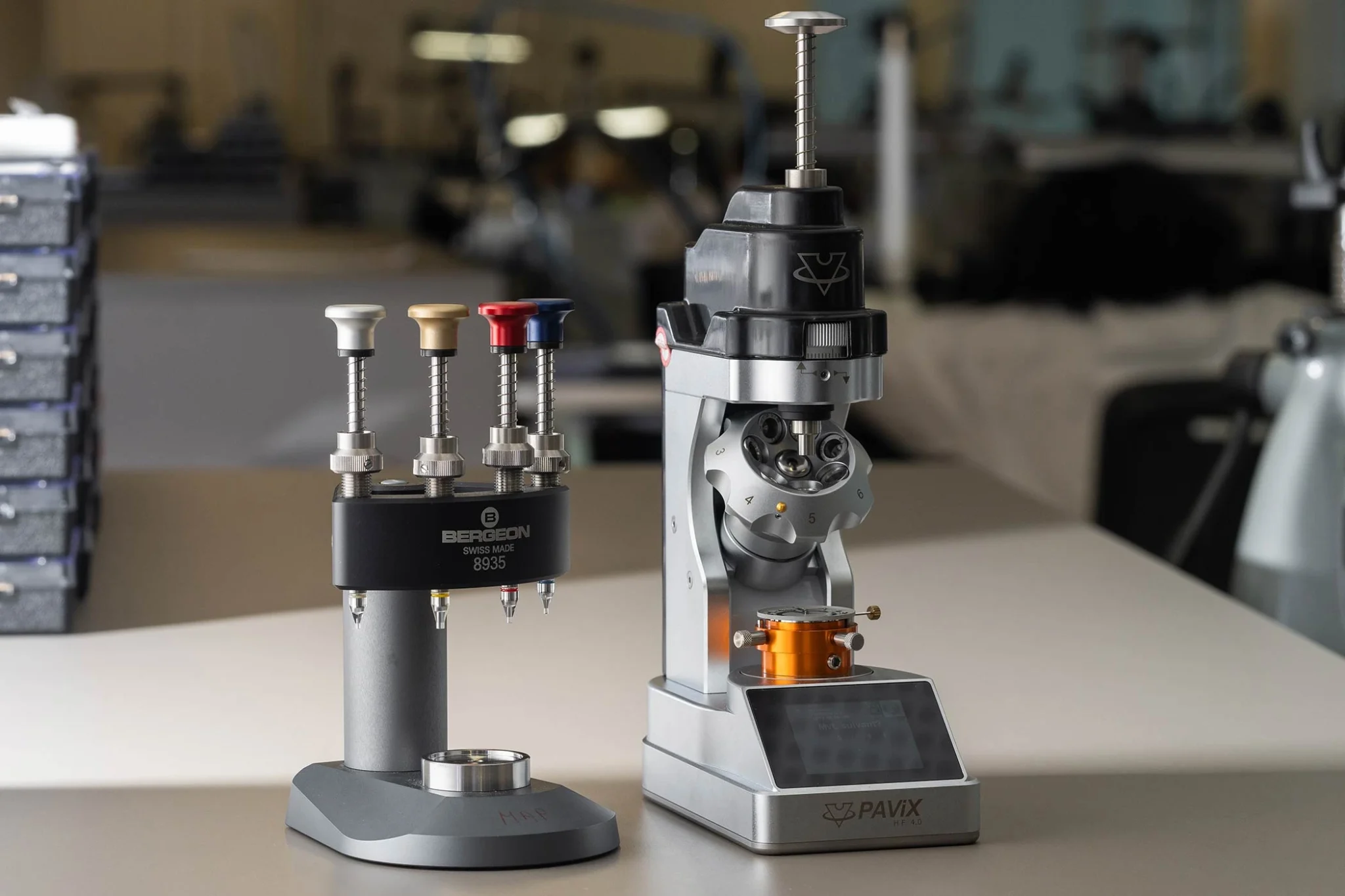 High-precision Pavix HF 4.0 equipment and Bergeon 8935 watchmaking tools on a workbench in a professional workshop