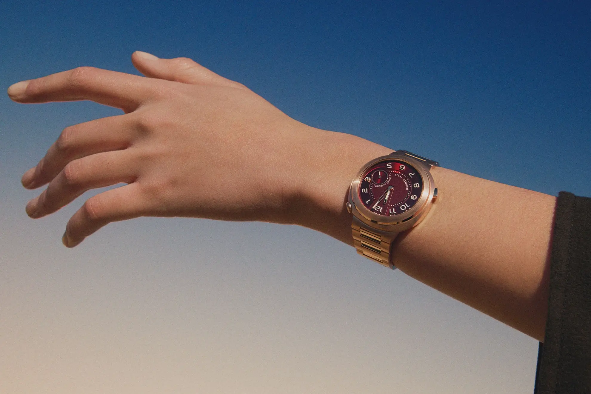 The Hermès Cut Le Temps Suspendu on the ladies' wrist