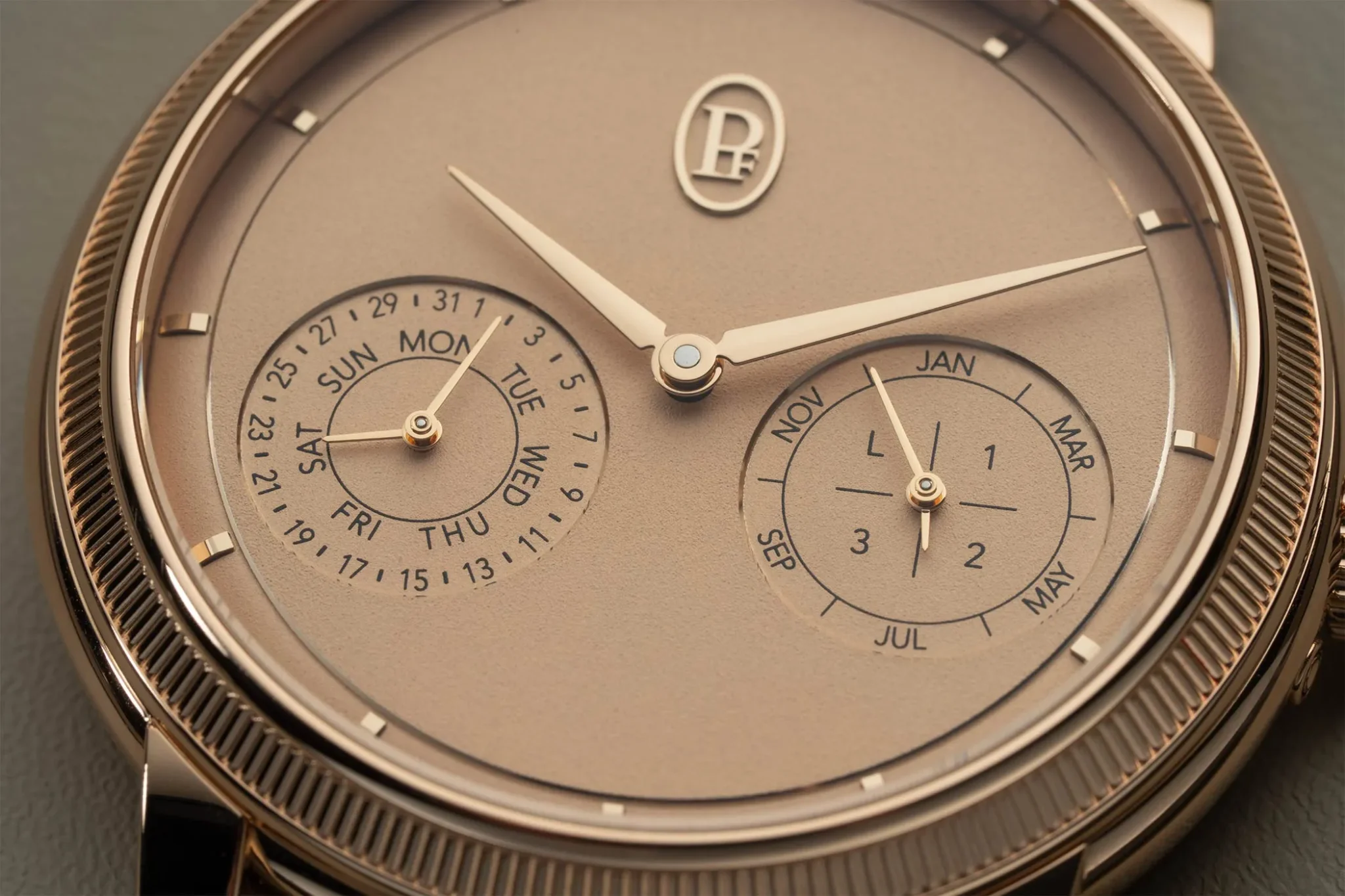 The rose-gold Parmigiani Fleurier Toric Quantieme Perpetuel with a dial in Golden Hour from up close.