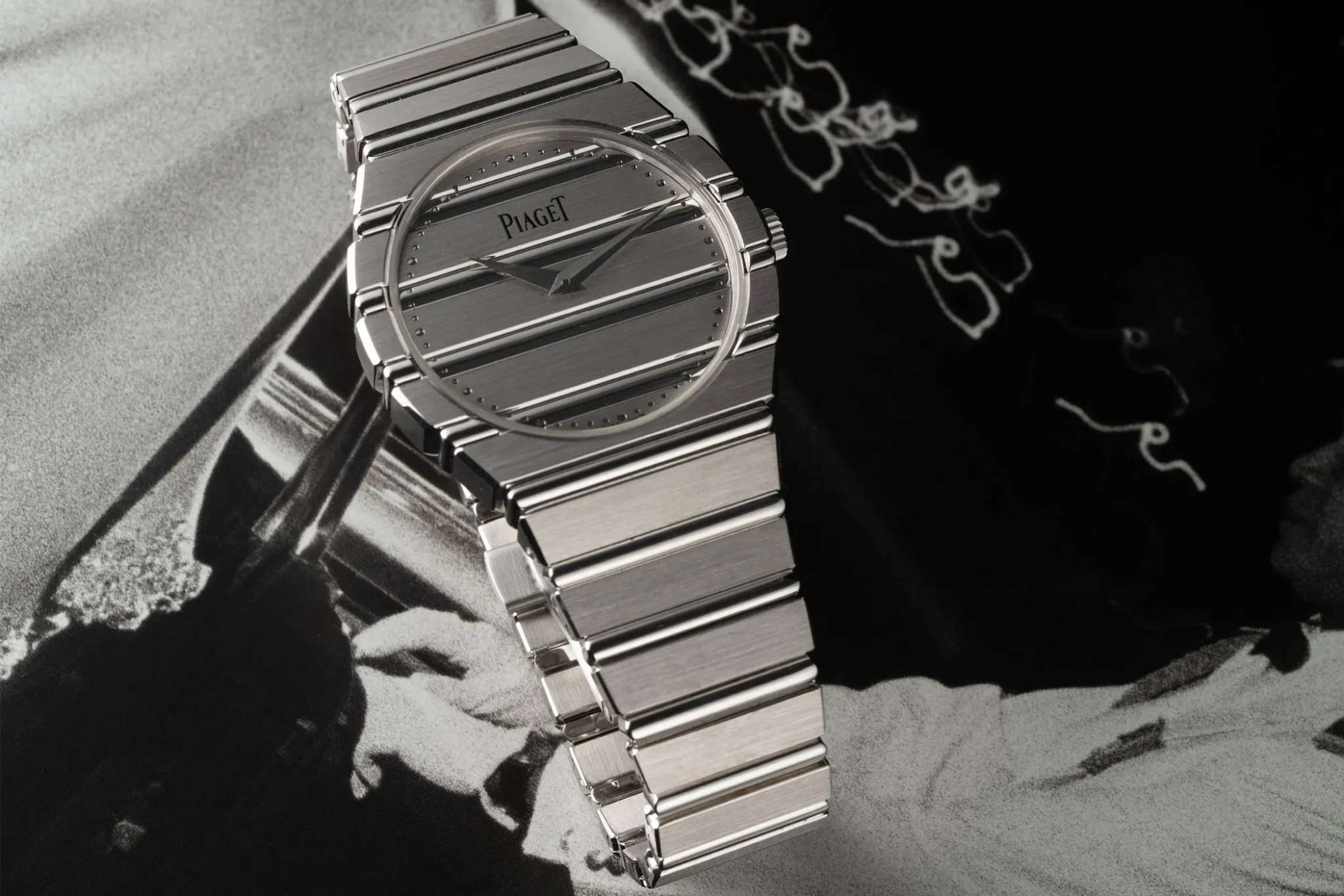 The Piaget Polo 79 white gold in full view on a monochrome surface.
