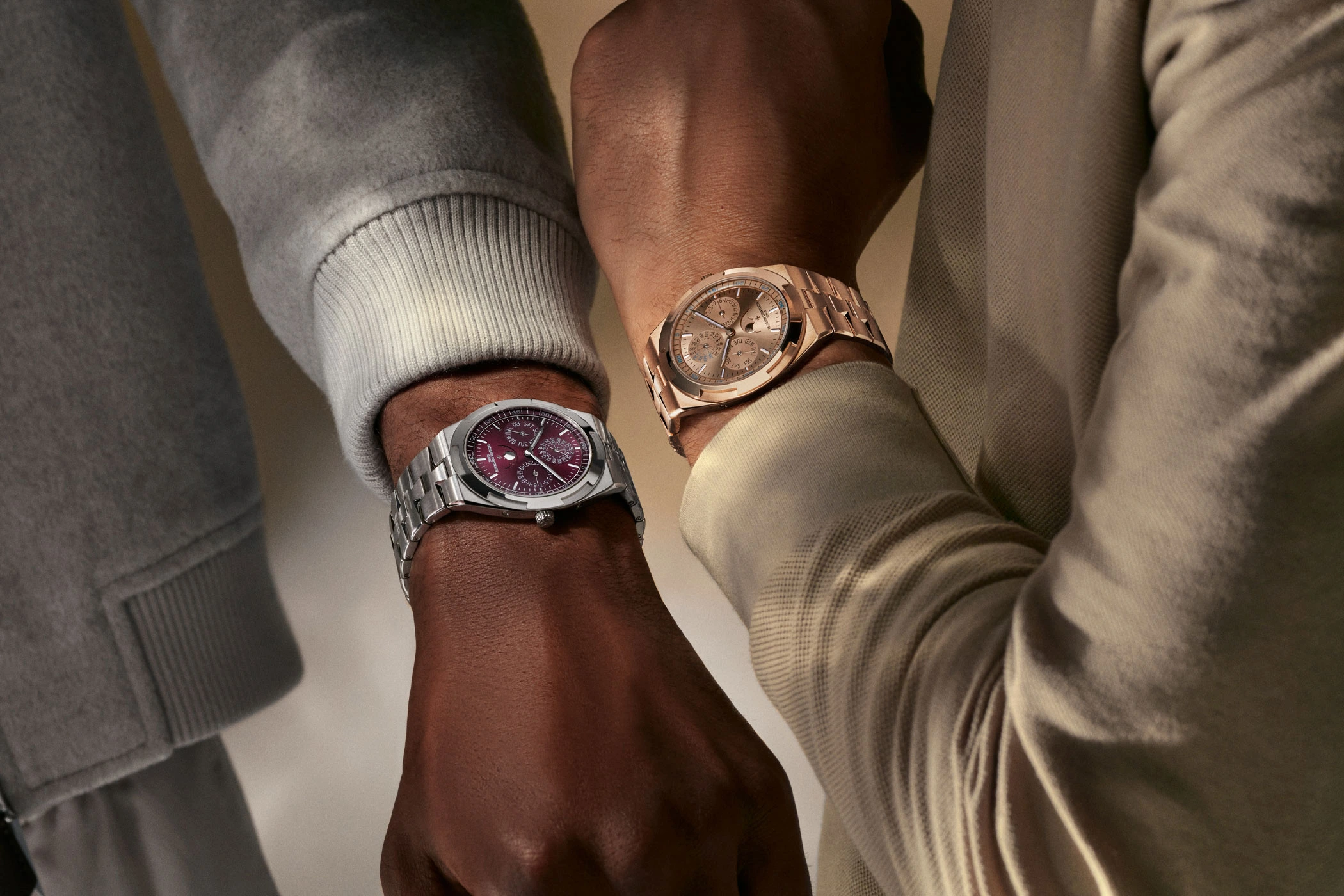The Vacheron Constantin Overseas Ultra-Thin Perpetual Calendar in white gold with a burgundy dial and in rose gold on the wrists.