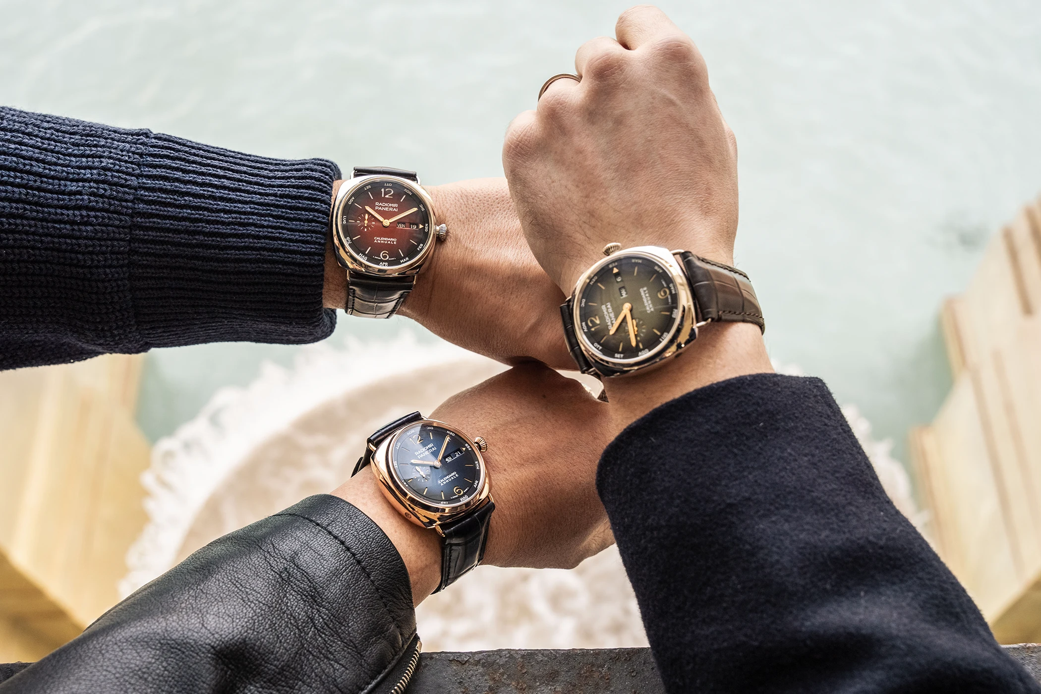 A wristshot of three wrists, including one wearing the Radiomir Annual Calendar Platinumtech during the Panerai Experience.