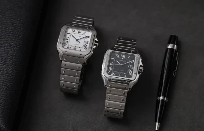 Side-by-side view of the Cartier Santos de Cartier references CRWSSA0089 in titanium and CRWSSA0096 in steel, highlighting their dial and case differences.