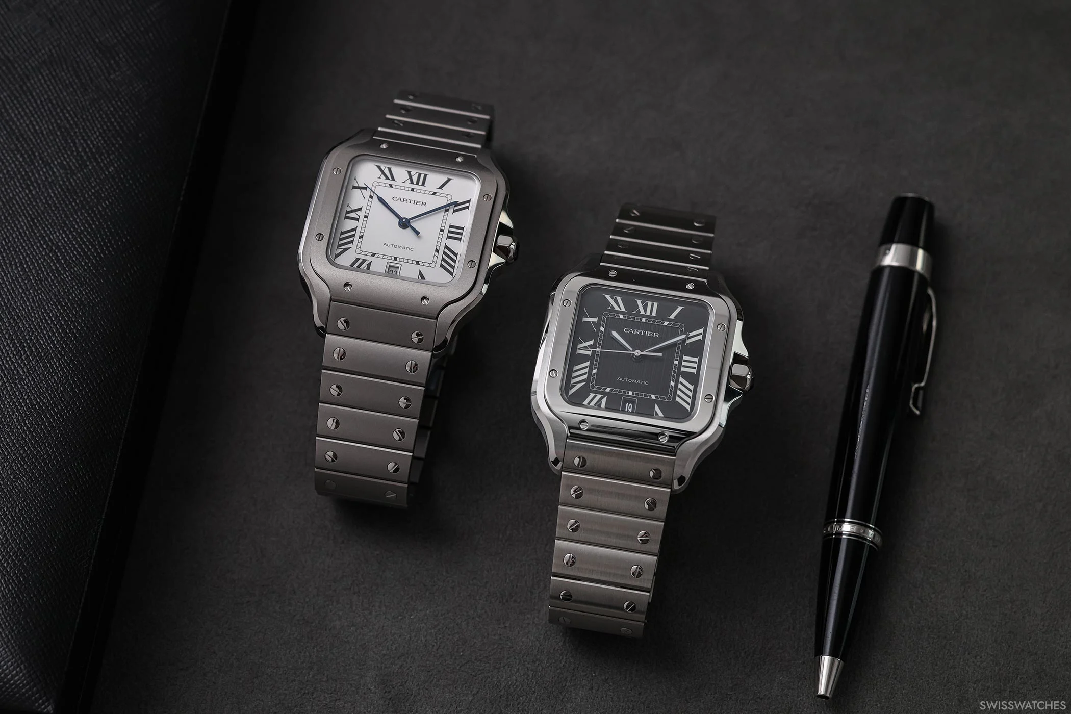 Side-by-side view of the Cartier Santos de Cartier references CRWSSA0089 in titanium and CRWSSA0096 in steel, highlighting their dial and case differences.