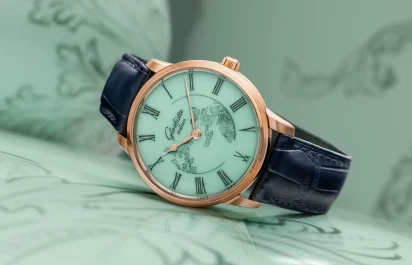 The Glashütte Original Senator Meissen with Mystic Maison in celadon green against a celadon green background.
