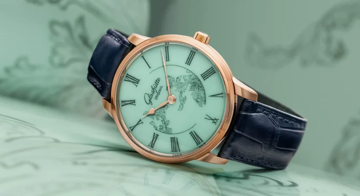 The Glashütte Original Senator Meissen with Mystic Maison in celadon green against a celadon green background.