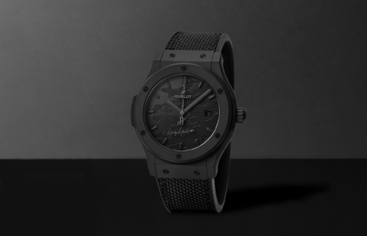 Front view of the Hublot Yohji Yamamoto All Black watch with black case and textured dial.