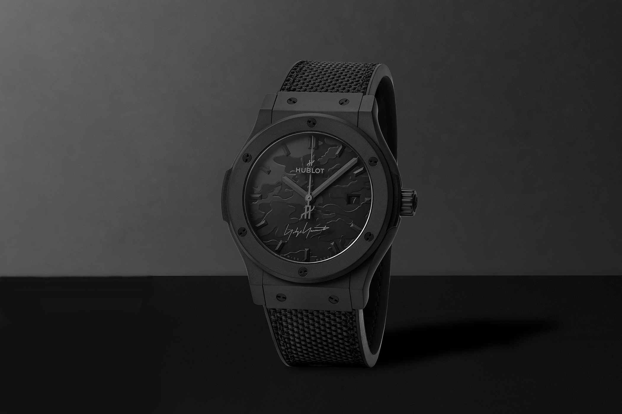 Front view of the Hublot Yohji Yamamoto All Black watch with black case and textured dial.