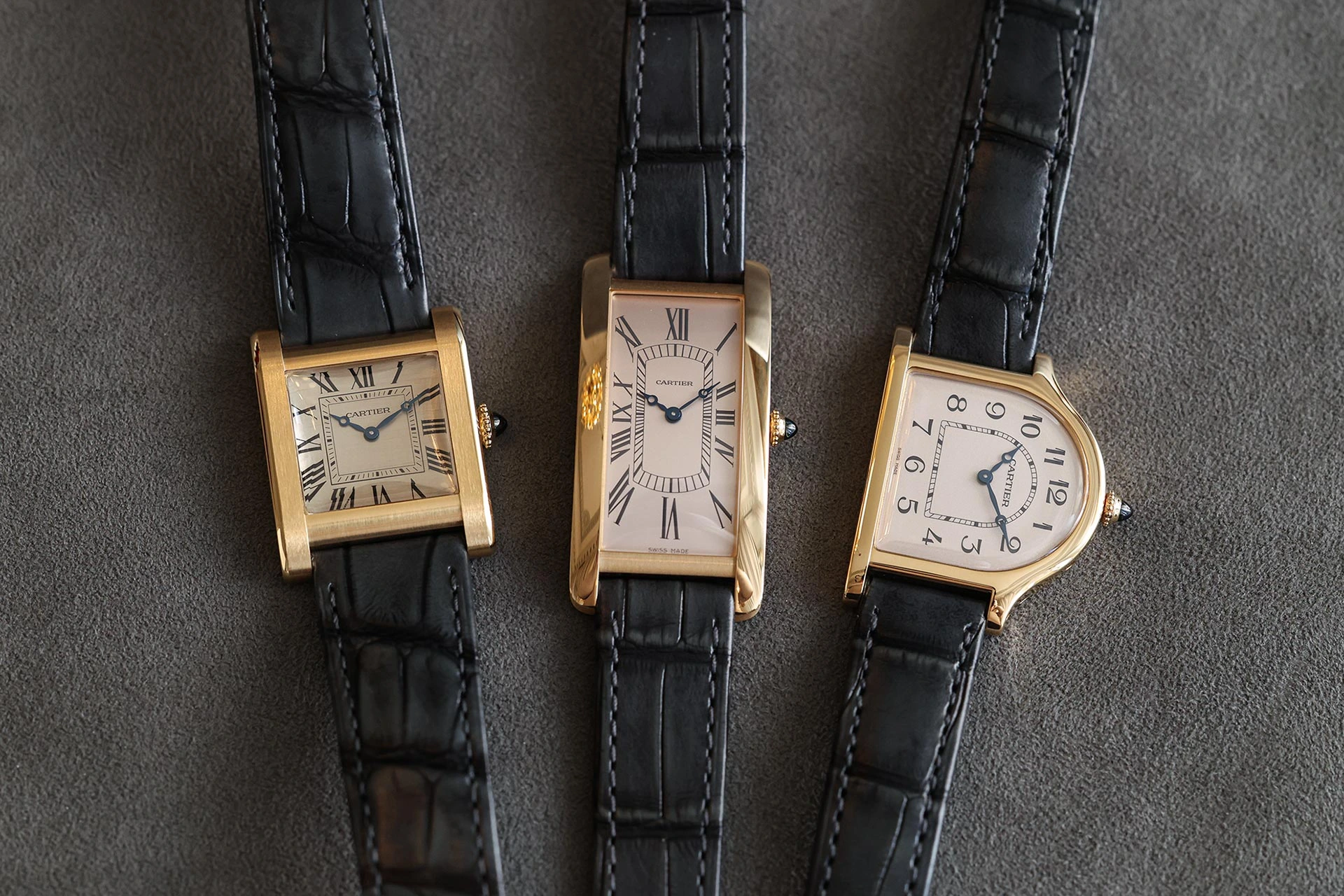Cartier Privé collection with Cloche, Tank Normale and Tank Cintrée models in yellow gold