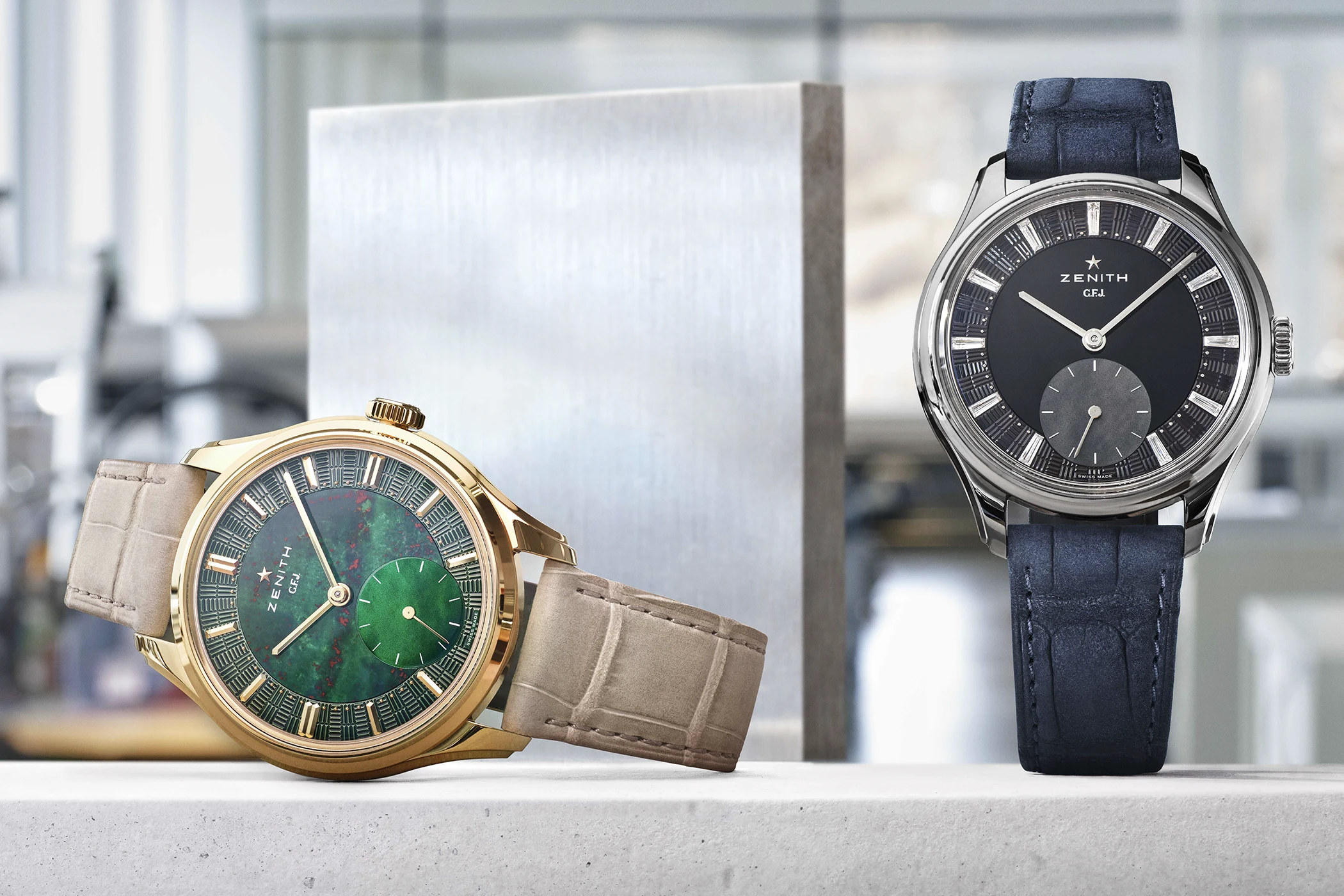 A front view of the Zenith G.F.J. in yellow gold with bloodstone and in tantalum with onyx.