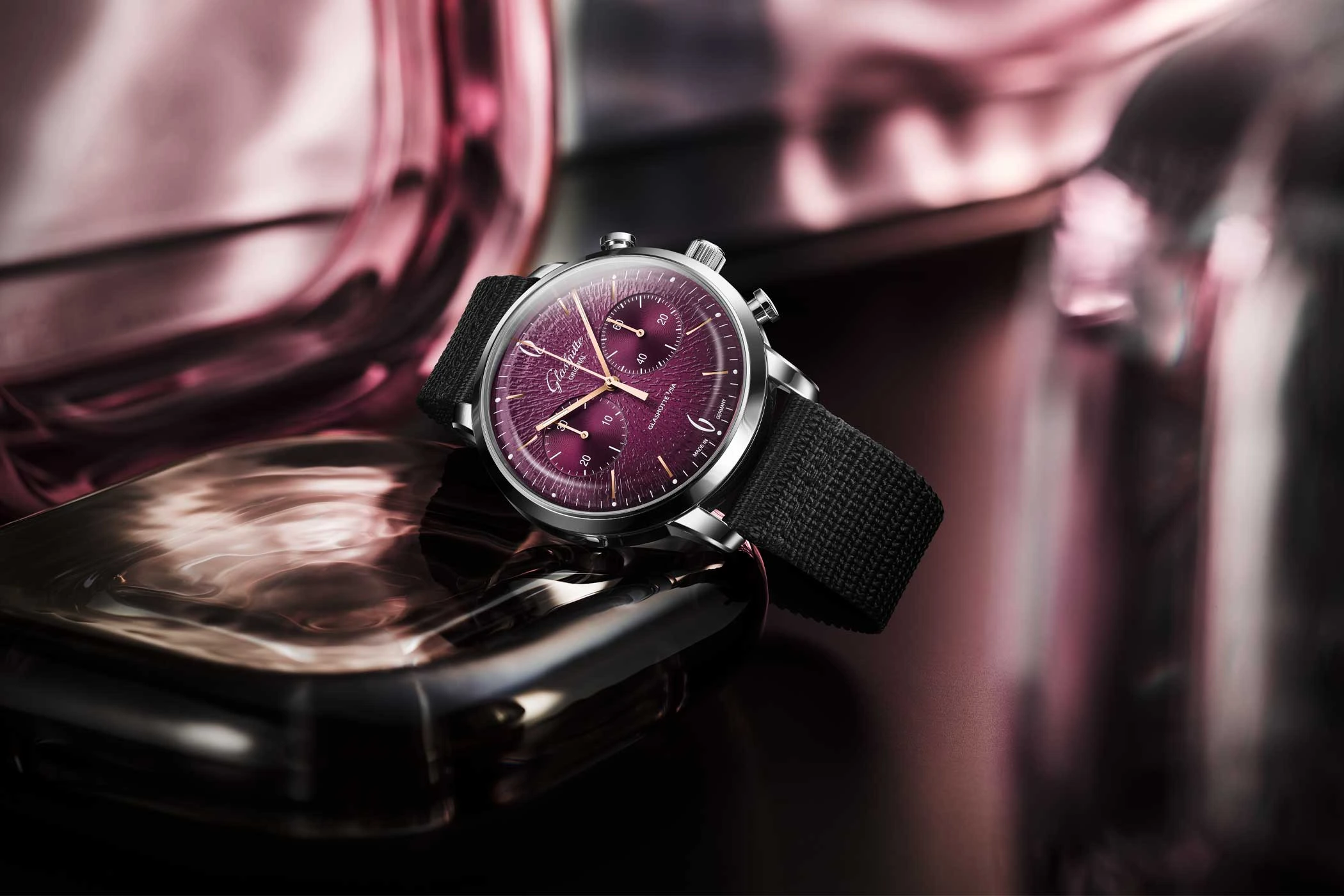 Sixties Chronograph Annual Edition by Glashütte with a violet dial, lying on its side.