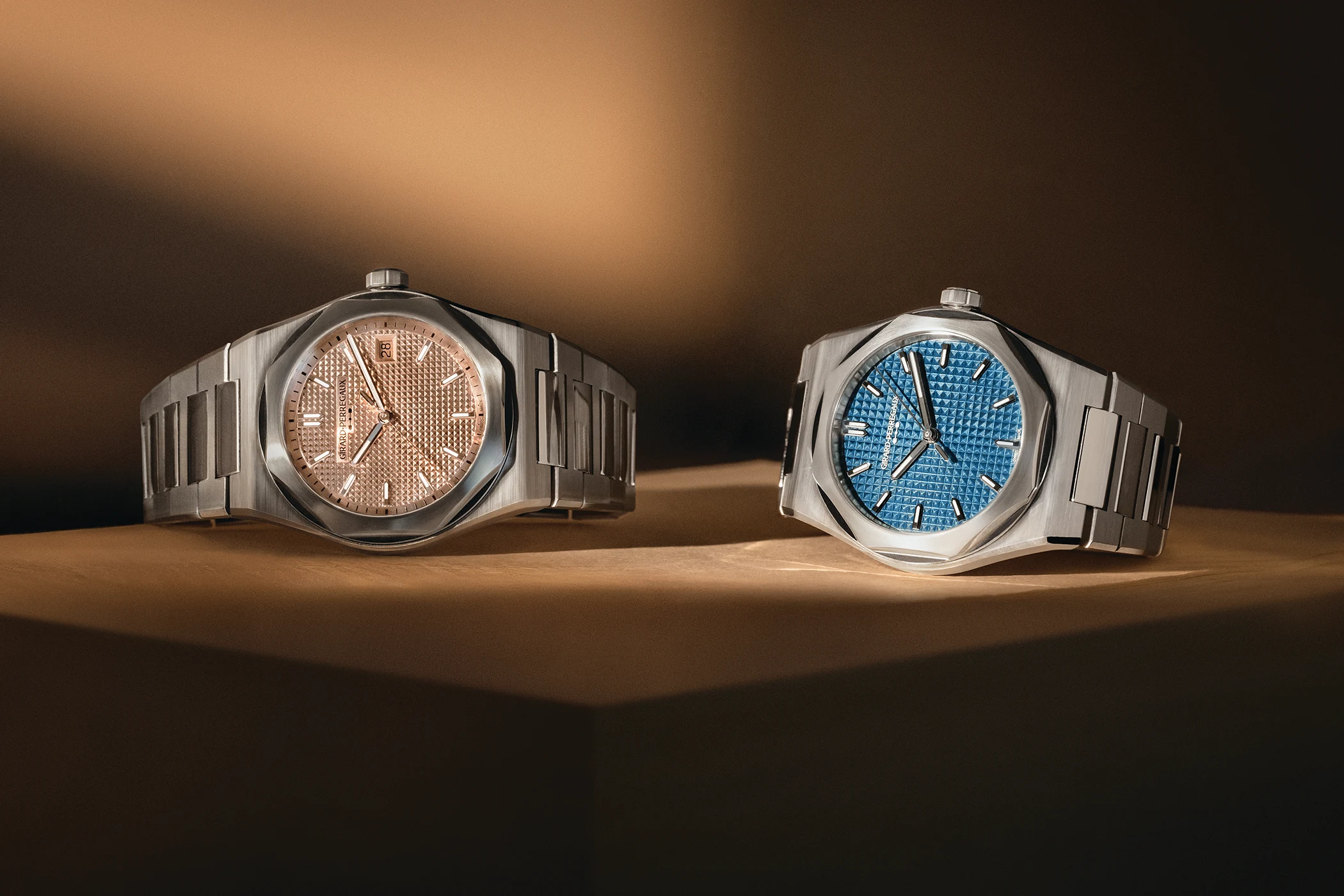 The Girard-Perregaux Laureato Fifty in 39 mm in rose and blue is shown together in a horizontal front view.