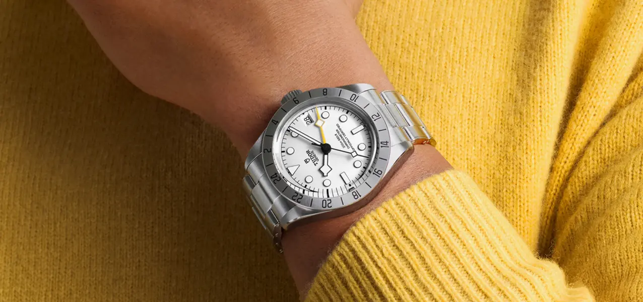 The Tudor Black Bay Pro with a white dial is shown on the wrist.