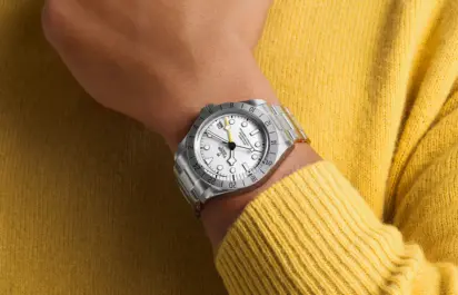 The Tudor Black Bay Pro with a white dial is shown on the wrist.