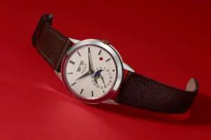 The Patek Philippe Ref. 3448G Perpetual Calendar Red Dot is shown from the front.