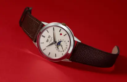 The Patek Philippe Ref. 3448G Perpetual Calendar Red Dot is shown from the front.