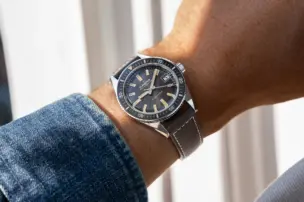 A Blancpain Fifty Fathoms Bathyscaphe 70th Anniversary 37 mm can be seen on the wrist.