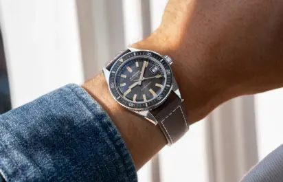 A Blancpain Fifty Fathoms Bathyscaphe 70th Anniversary 37 mm can be seen on the wrist.