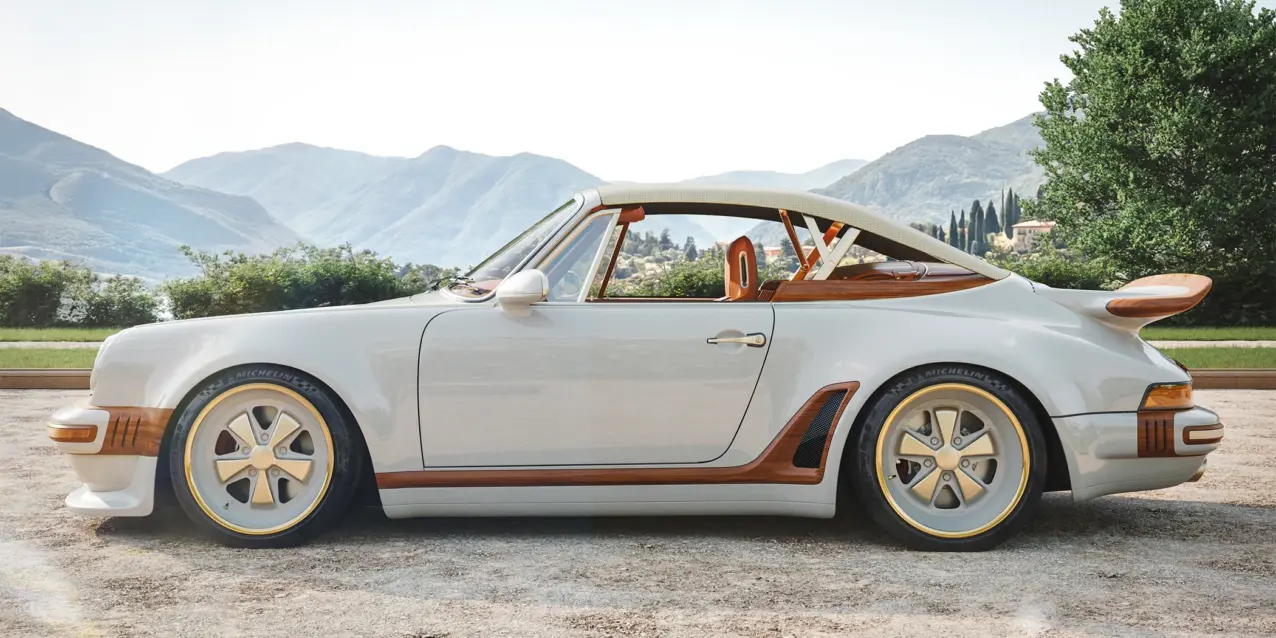 A Singer x Louis Vuitton Porsche 911 Classic Turbo Cabriolet is seen from the side.