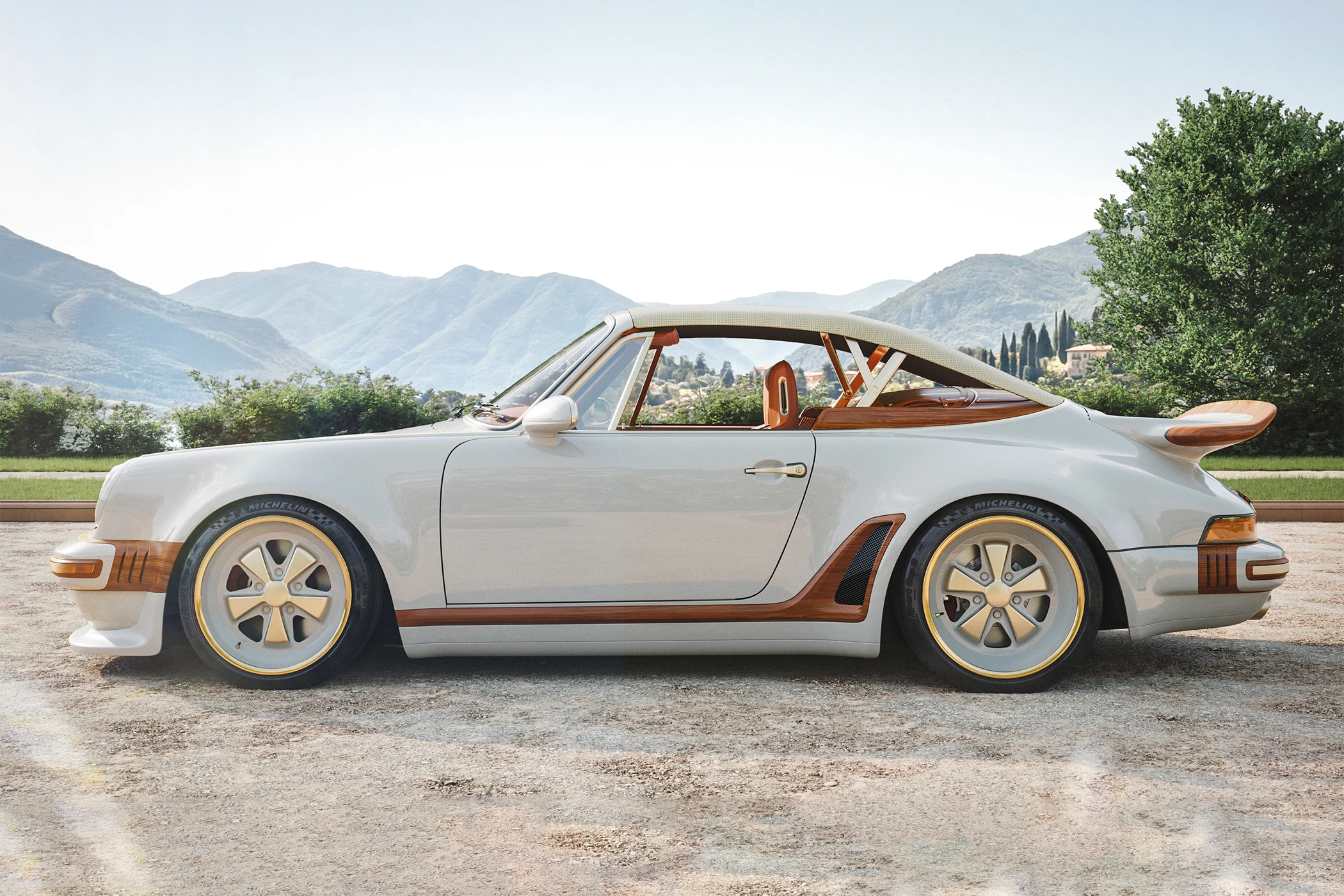 A Singer x Louis Vuitton Porsche 911 Classic Turbo Cabriolet is seen from the side.