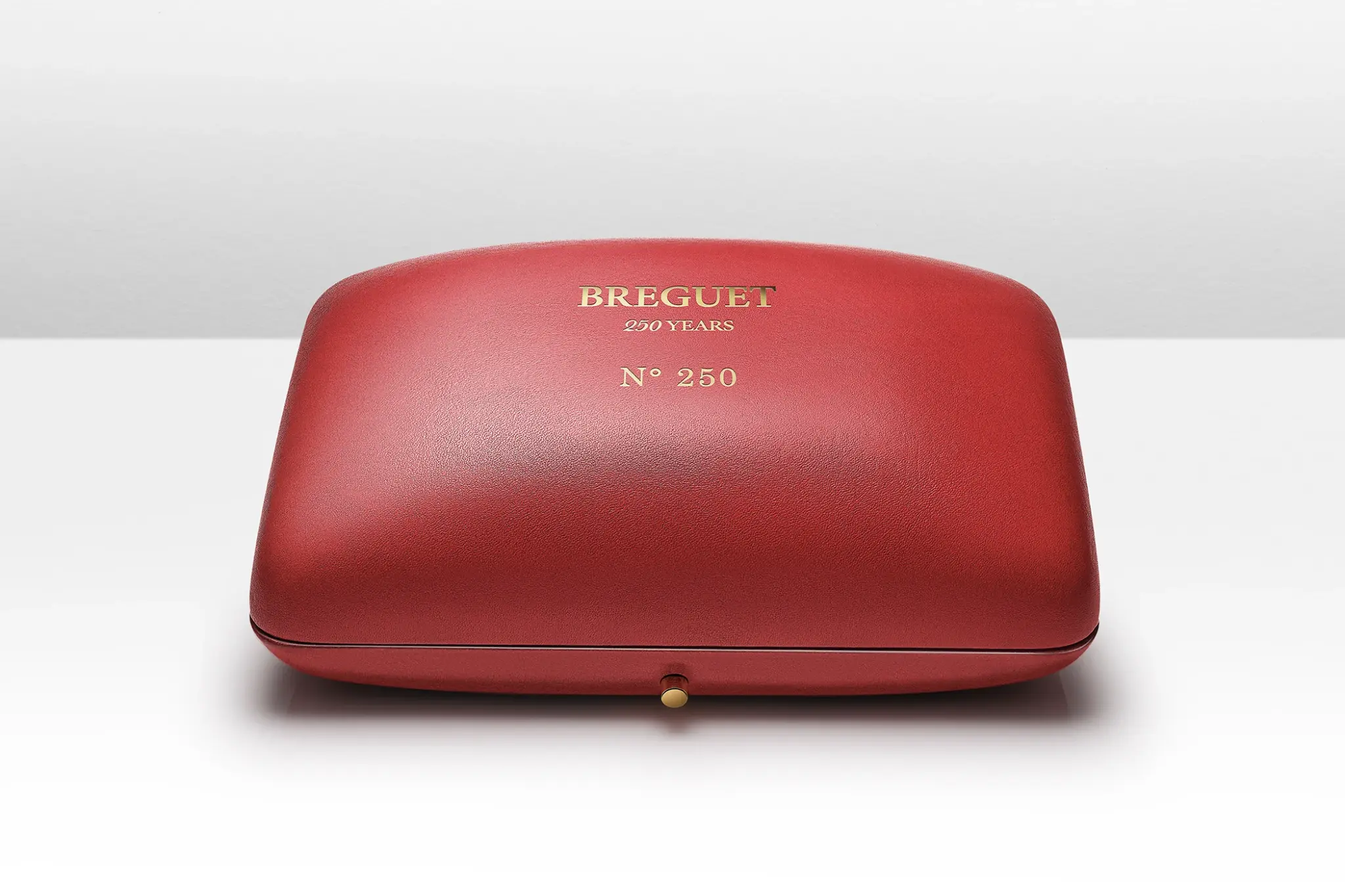The Breguet Tradition Seconde Rétrograde 7035BH/H2/9V6 and its case made of red leather